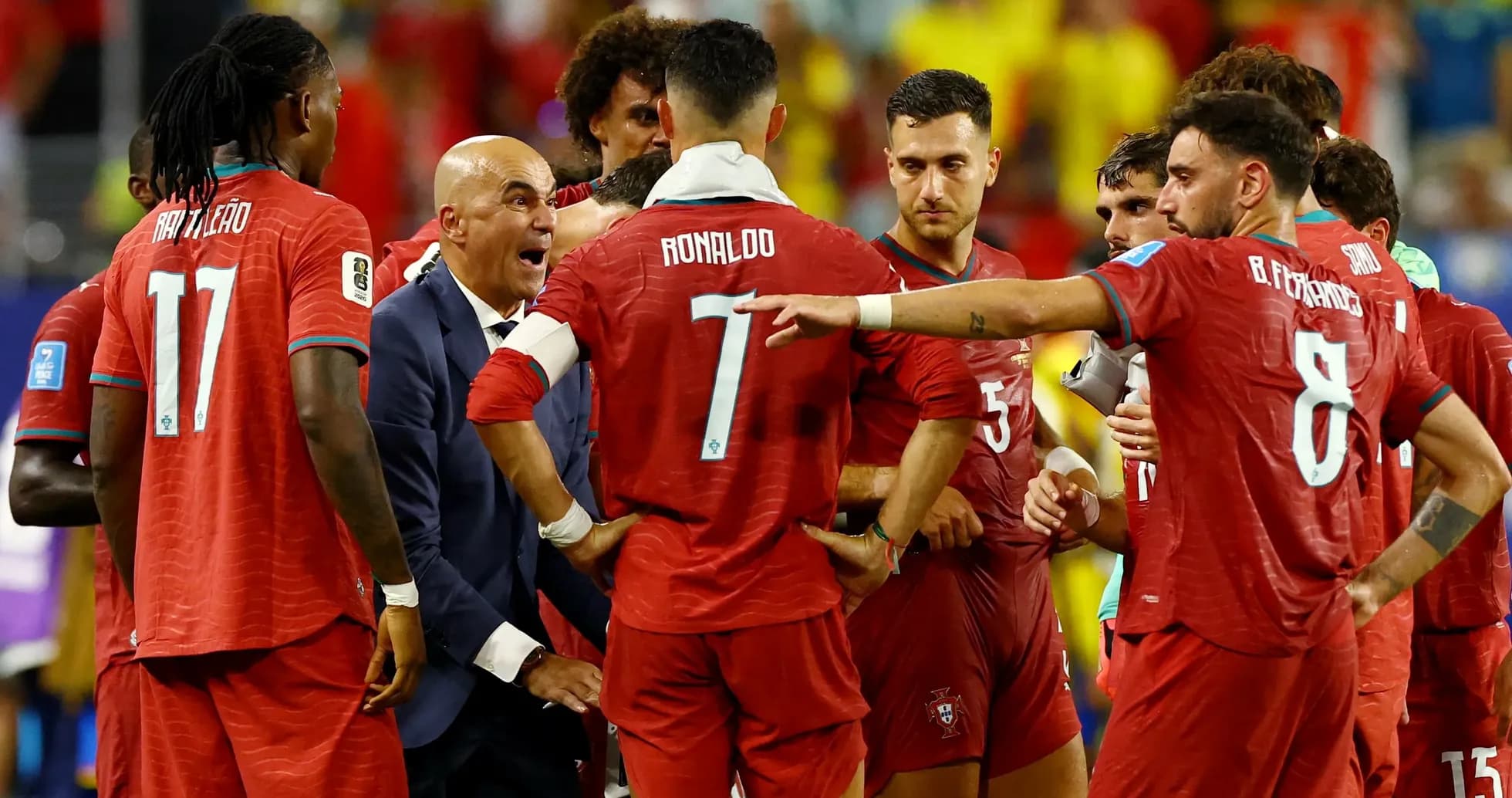 Portugal players discussing strategy during match