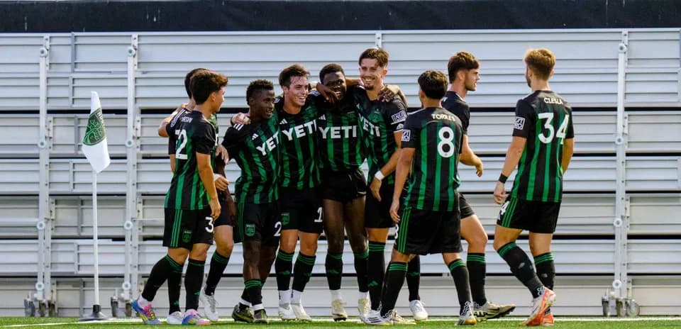 Players celebrating a goal during match
