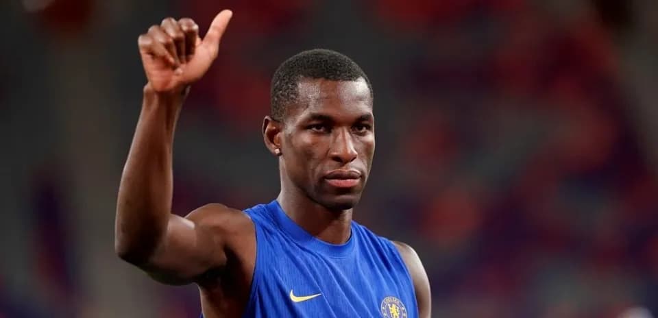Player in blue jersey giving a thumbs up