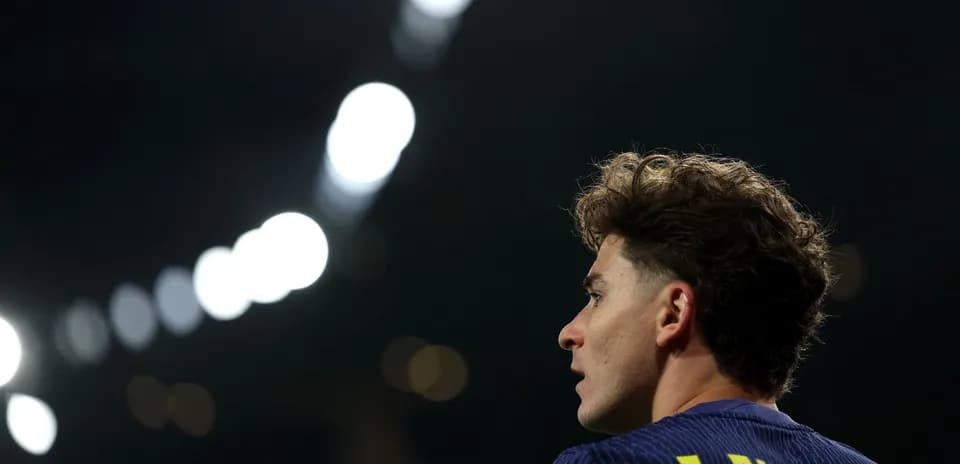 Player looking away during match under stadium lights