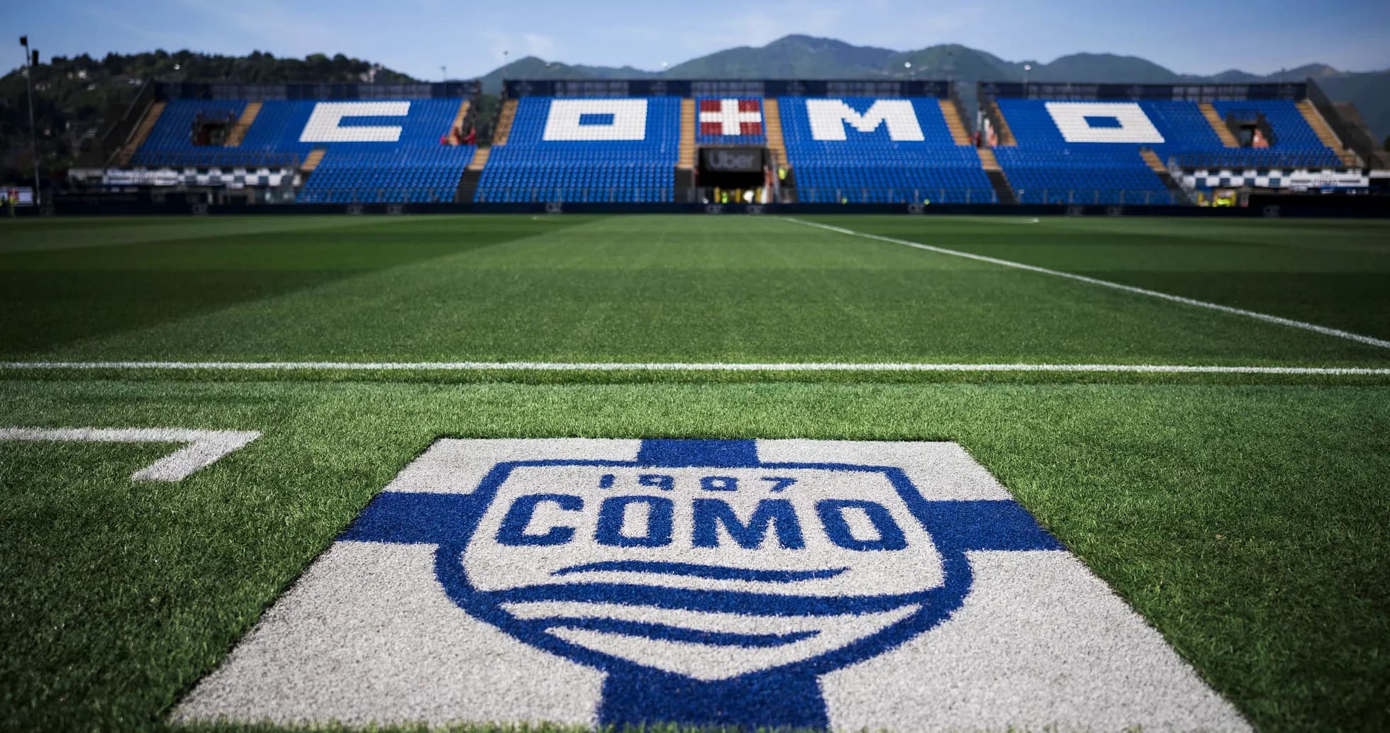 Como stadium with team logo on the pitch