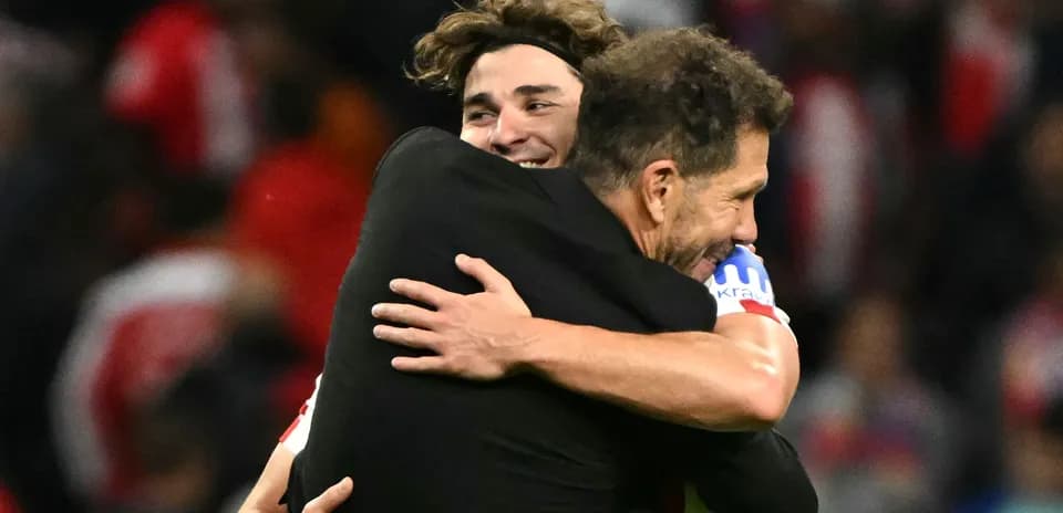 Two players embracing after a match celebration
