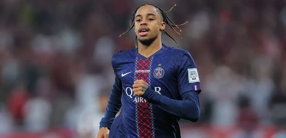Player running on field in Paris Saint-Germain kit