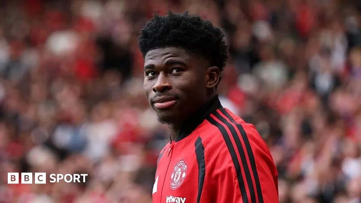 Player wearing Manchester United kit on field
