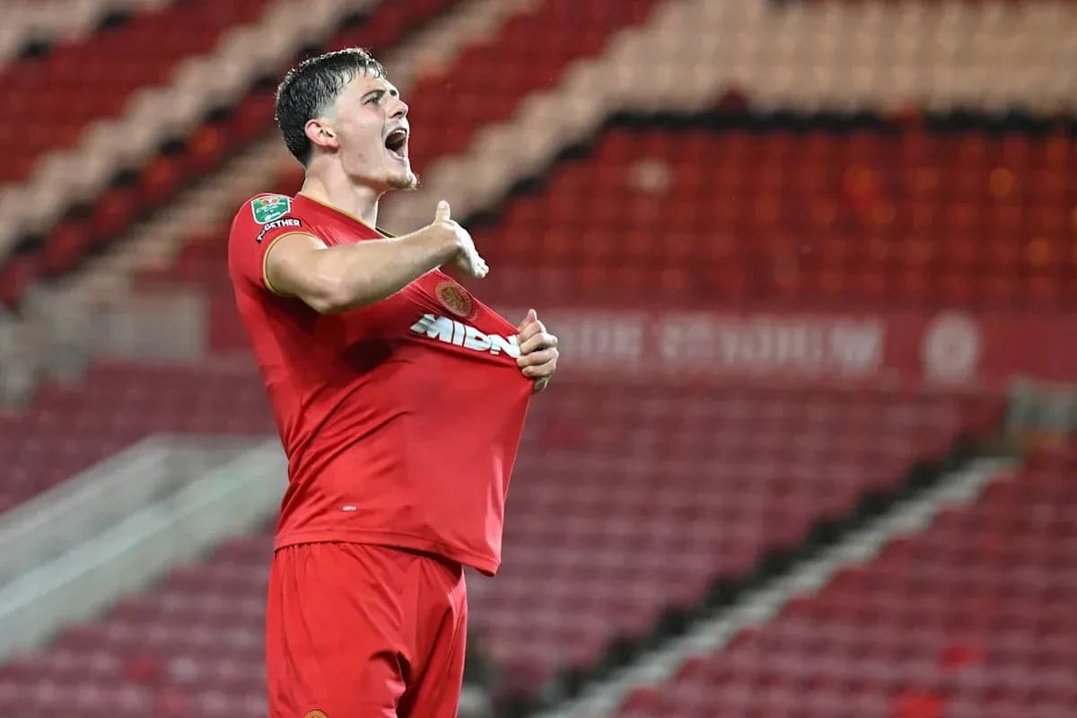 Player celebrating by lifting shirt after scoring