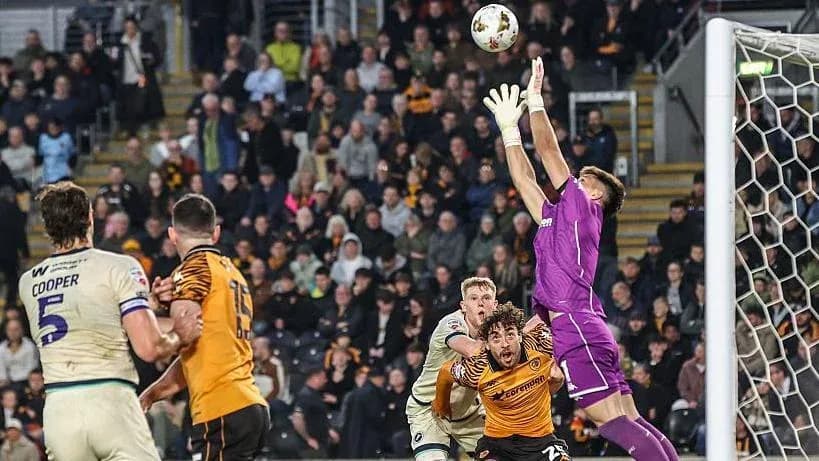 Goalkeeper catching the ball during a match