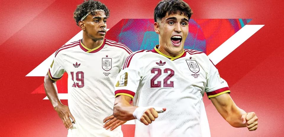Two Spanish football players in team jerseys