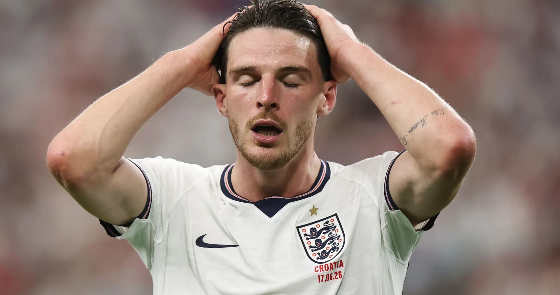 Player in England kit reacting during match
