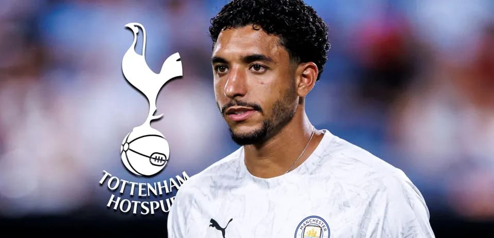 Player in Manchester City kit with Tottenham logo