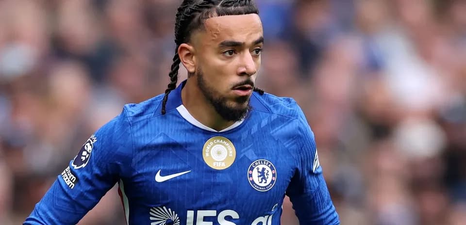 Player in blue Chelsea kit running on the field
