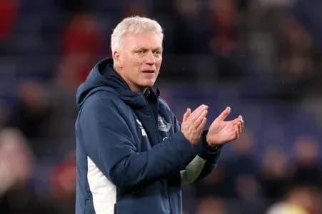 Manager applauding during match on sideline