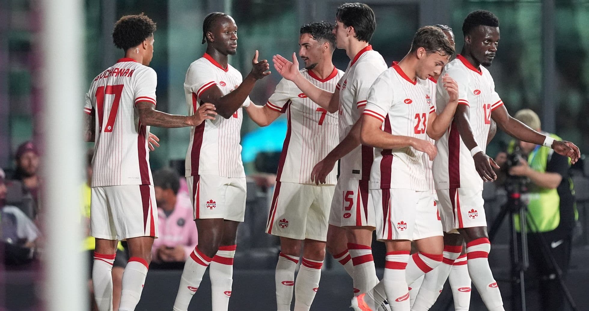Canadian players celebrating during World Cup match