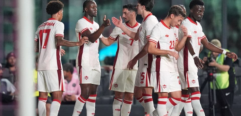 Canadian players celebrating during World Cup match