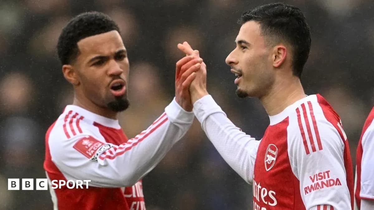 Two Arsenal players celebrating a goal together
