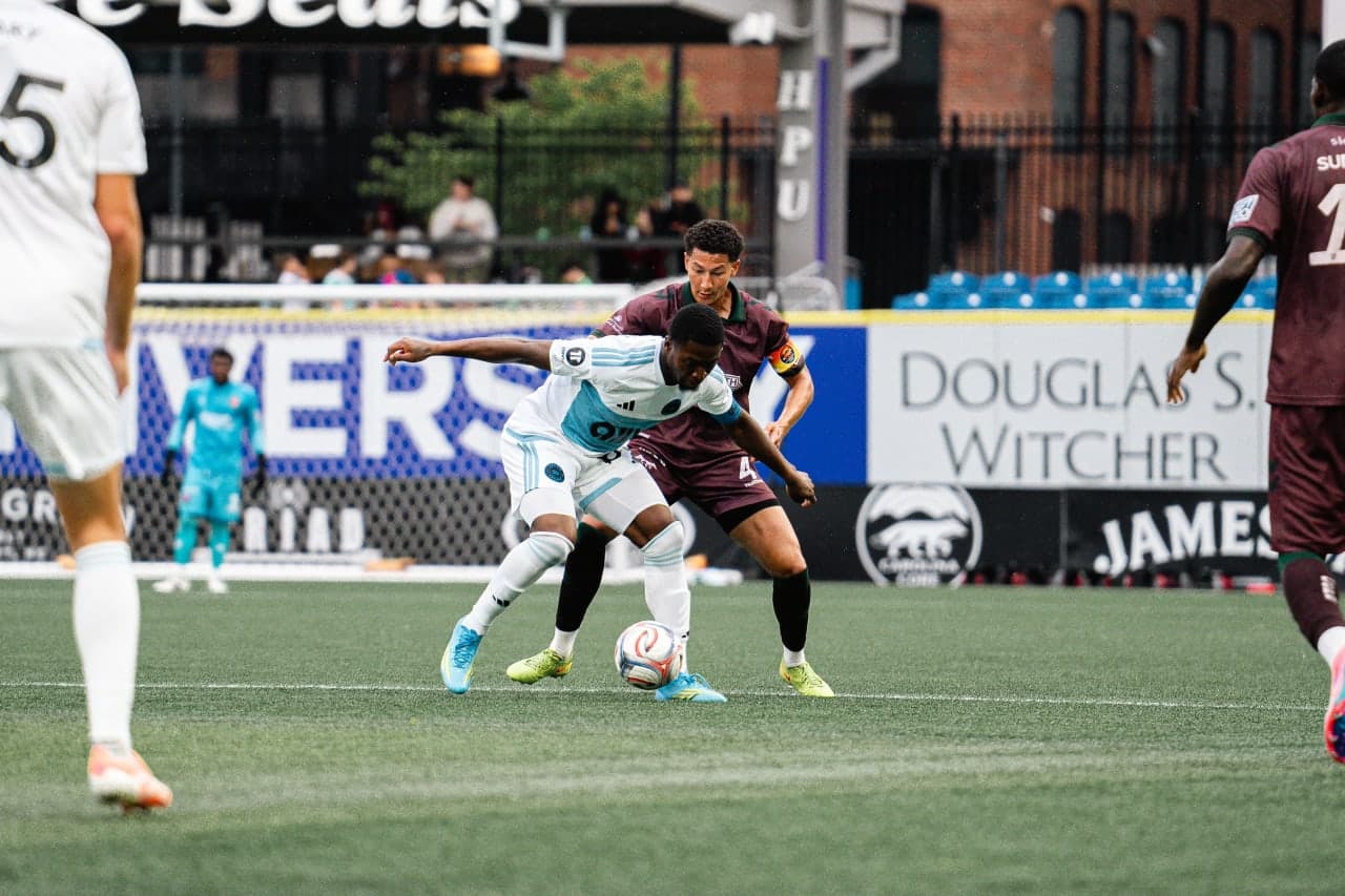 Players competing for the ball during match