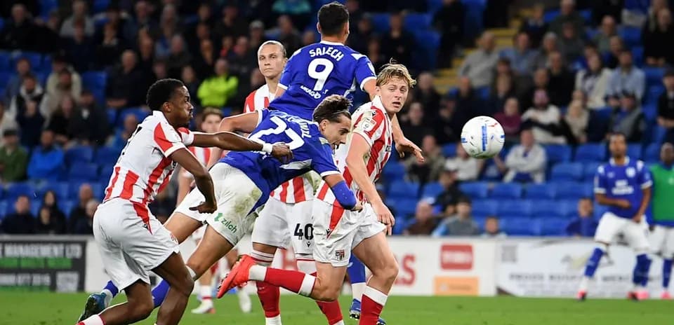 Player heading the ball during intense match action