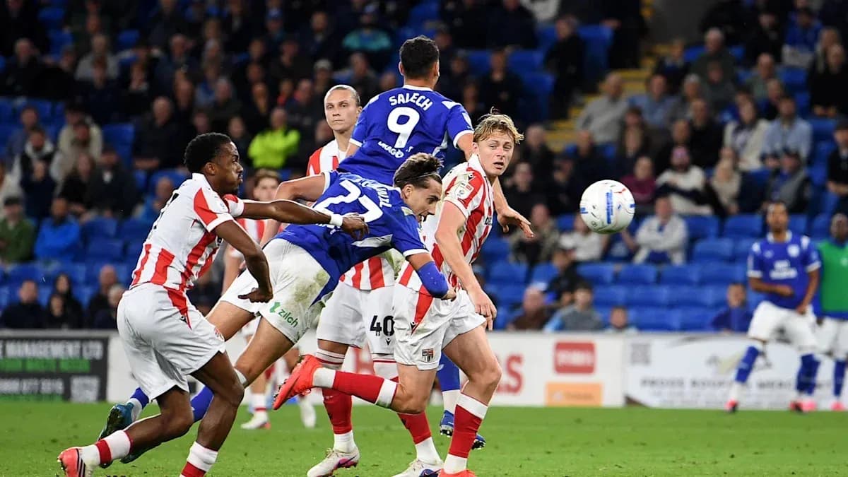 Player heading the ball during intense match action