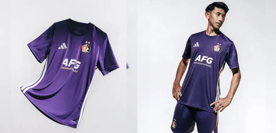 Purple football kit displayed with model wearing it