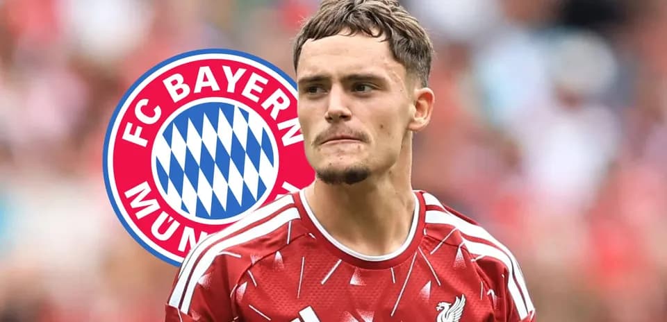 Player wearing Liverpool kit with Bayern Munich logo background