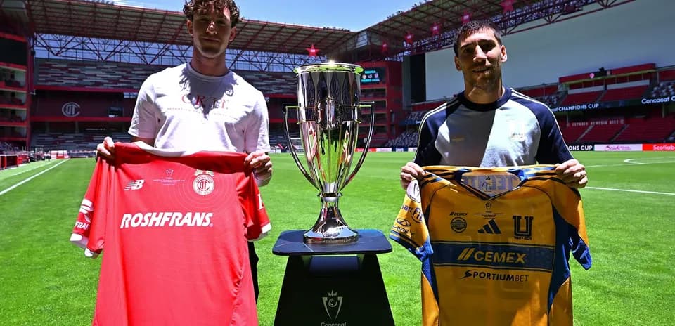 Players holding jerseys before Champions League match