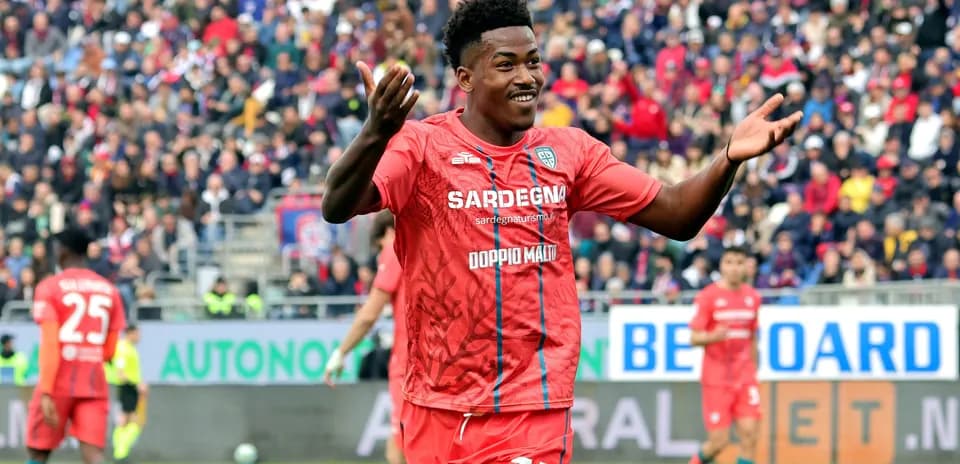 Player celebrating in red team uniform during match