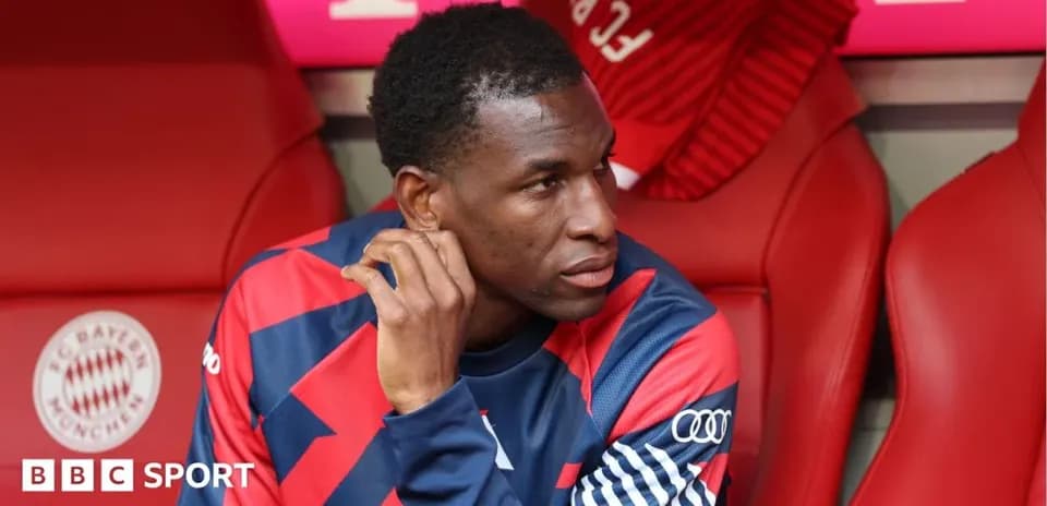 Player seated on bench during match at stadium