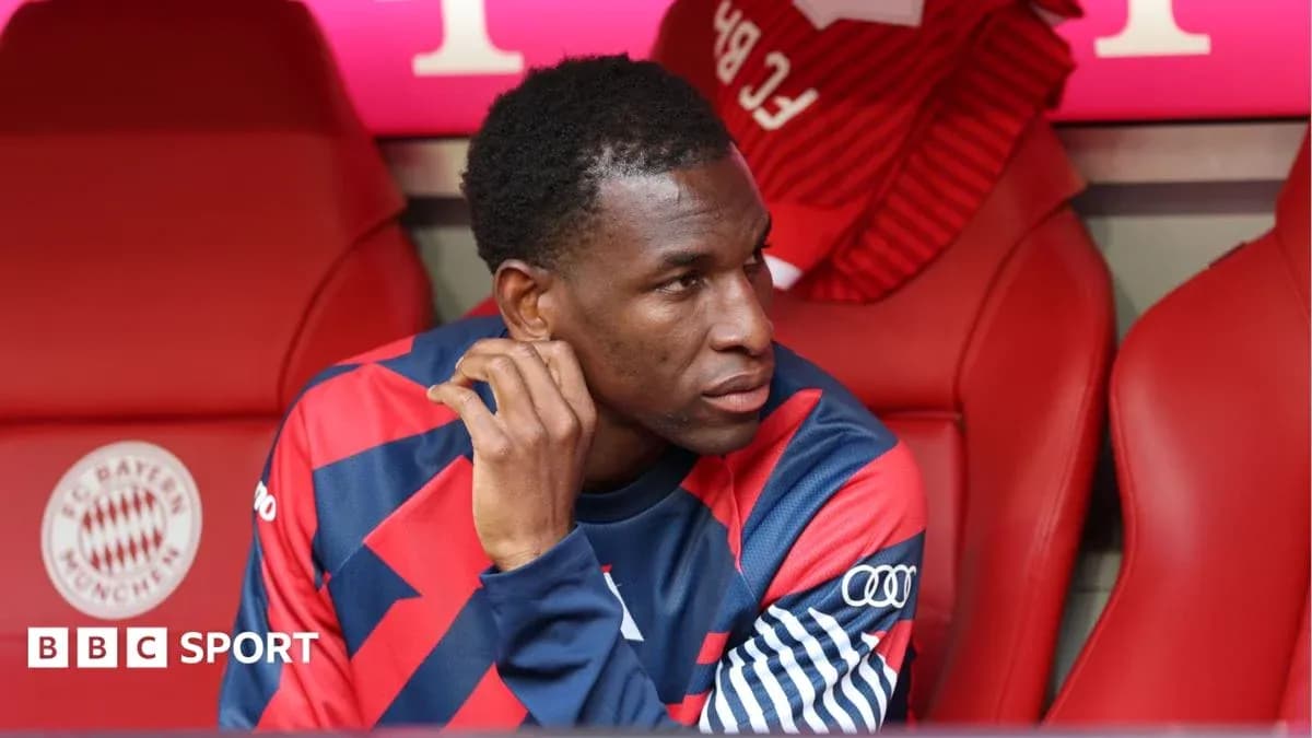 Player seated on bench during match at stadium