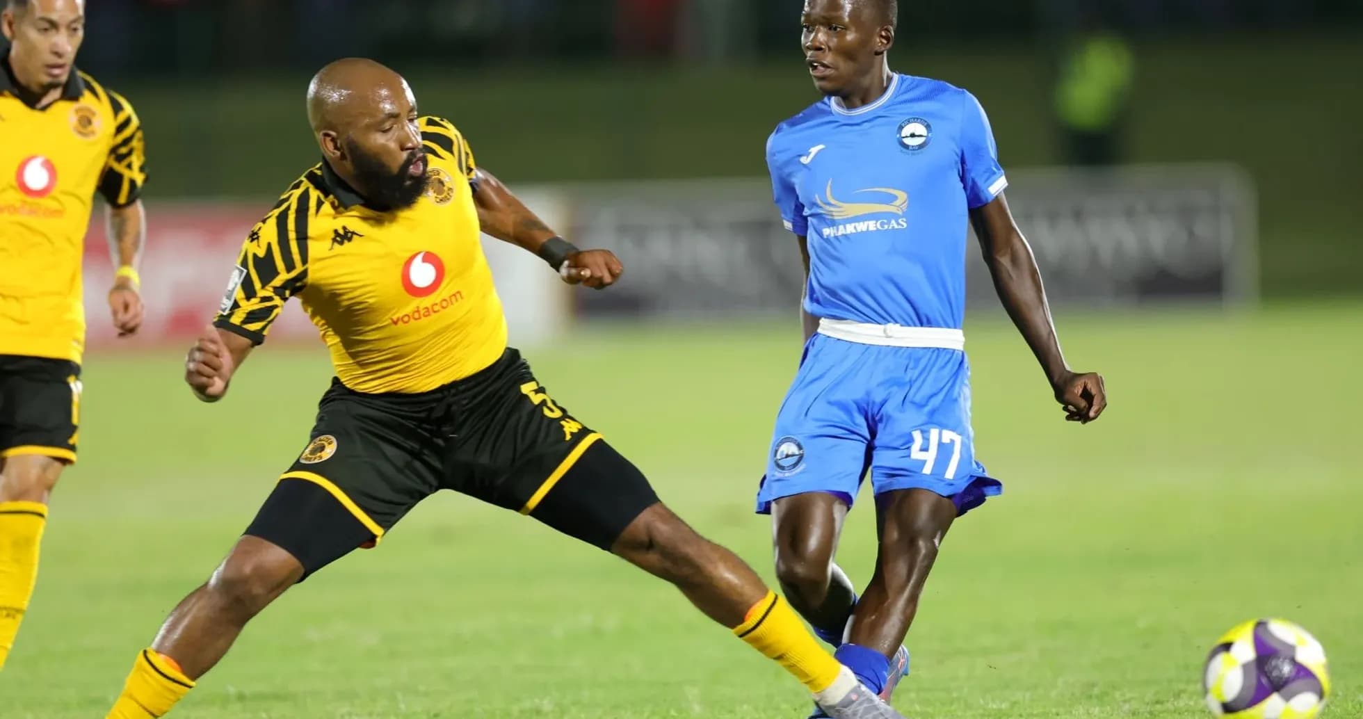 Players from Kaizer Chiefs and opponents competing for the ball