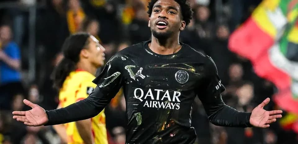 Player celebrating during a match with PSG jersey