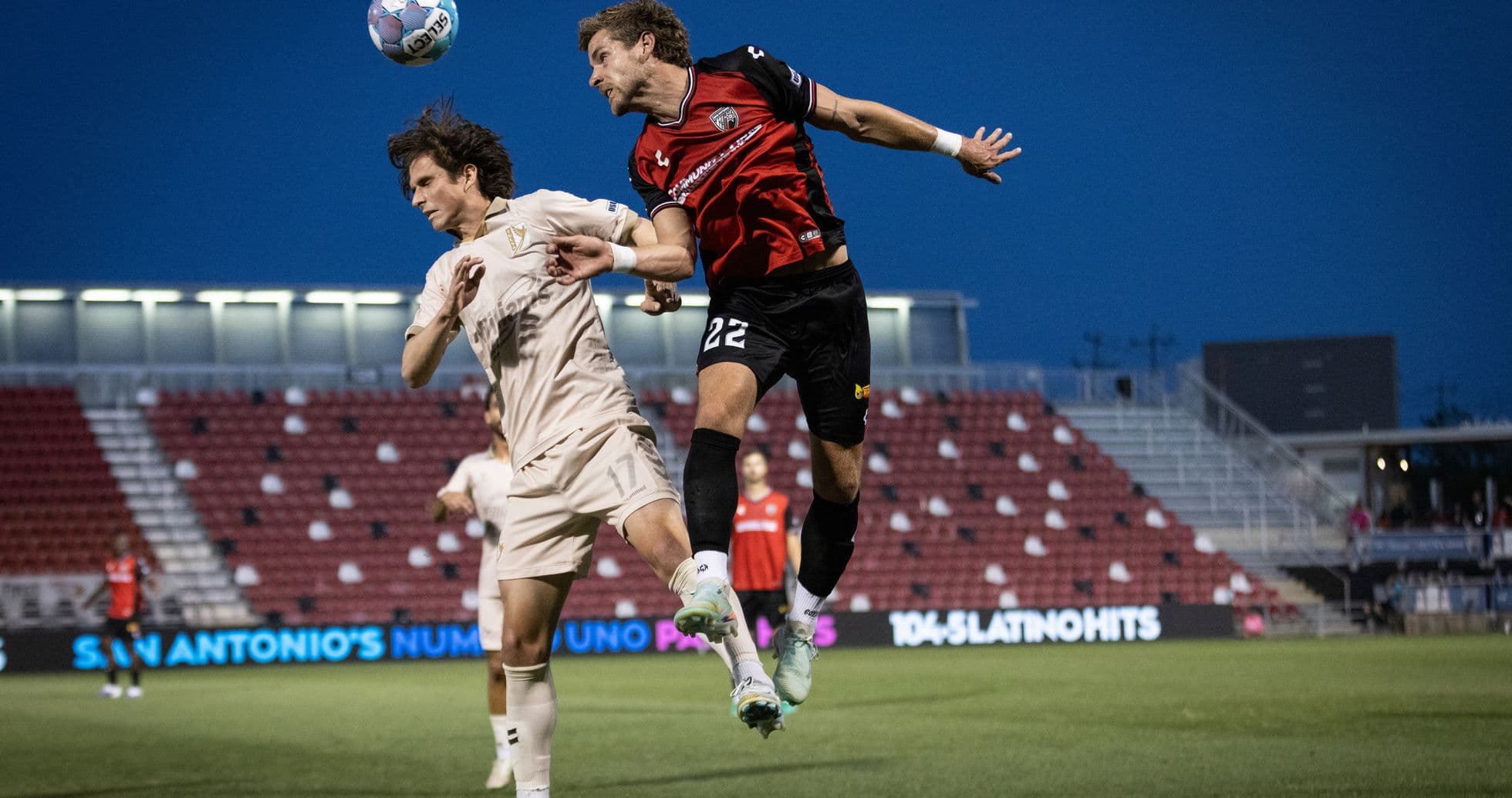 Players competing for the ball during match