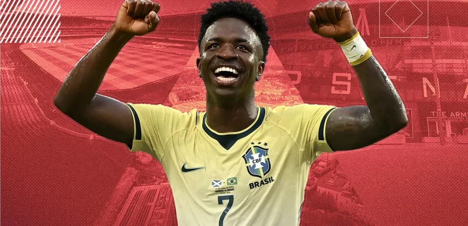 Player celebrating with raised fists in Brazil kit