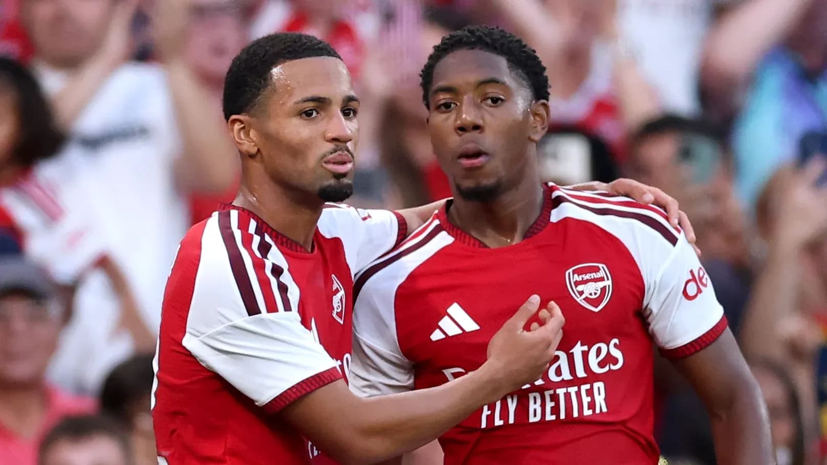 Two Arsenal players celebrating after a goal