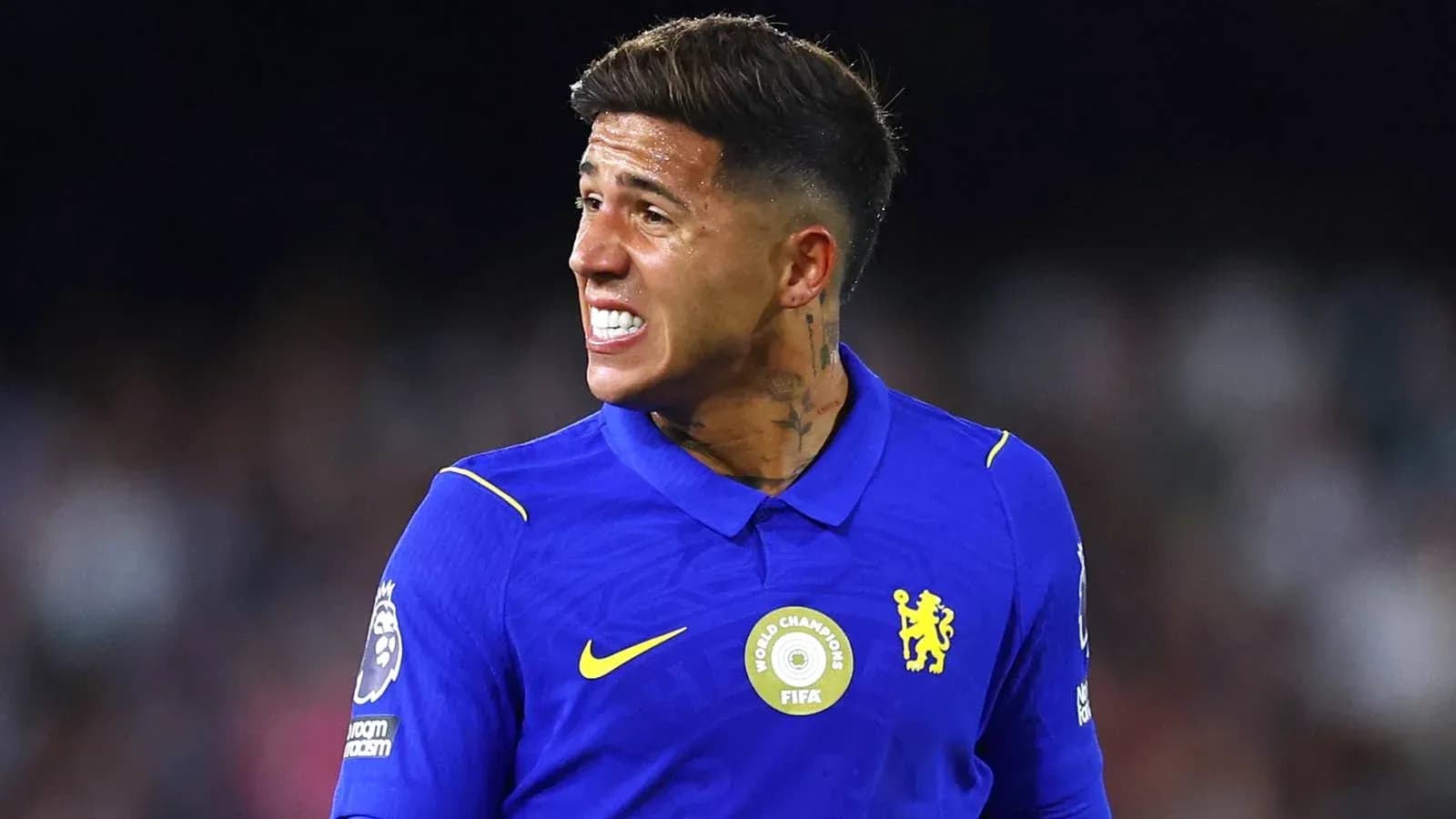 Player in blue jersey reacting during match