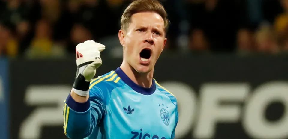 Goalkeeper celebrating with raised fist during match