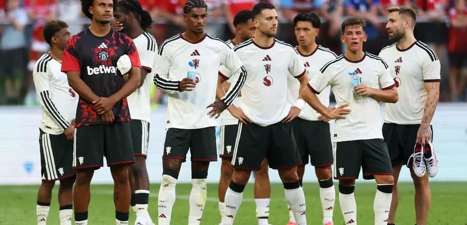 Football players standing together during match pause
