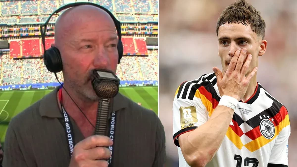 Sportscaster speaking into microphone during match