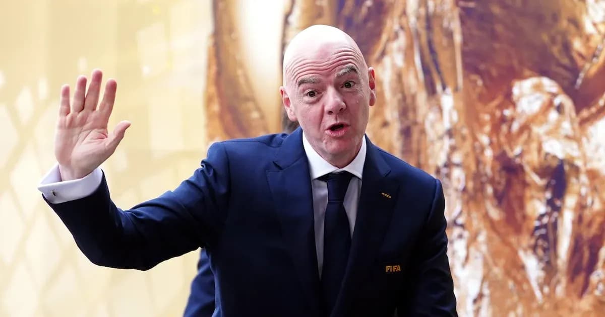FIFA official waving during a public appearance