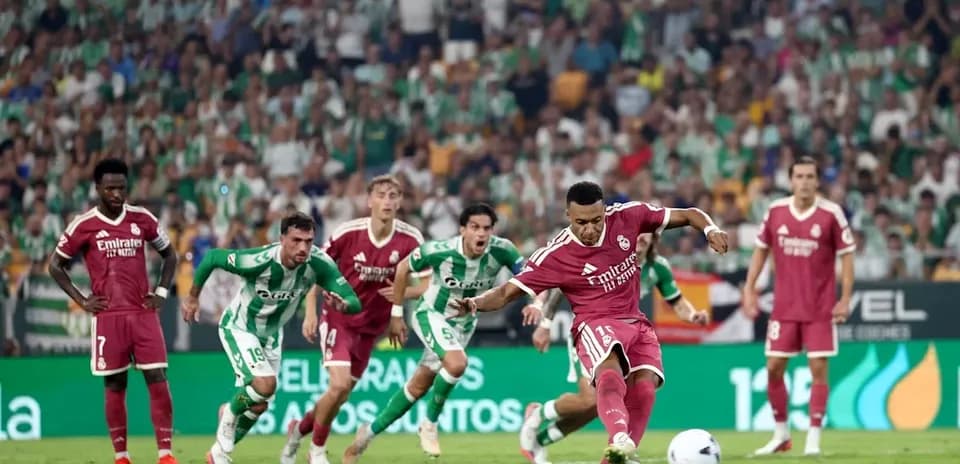 Player taking a penalty kick during football match