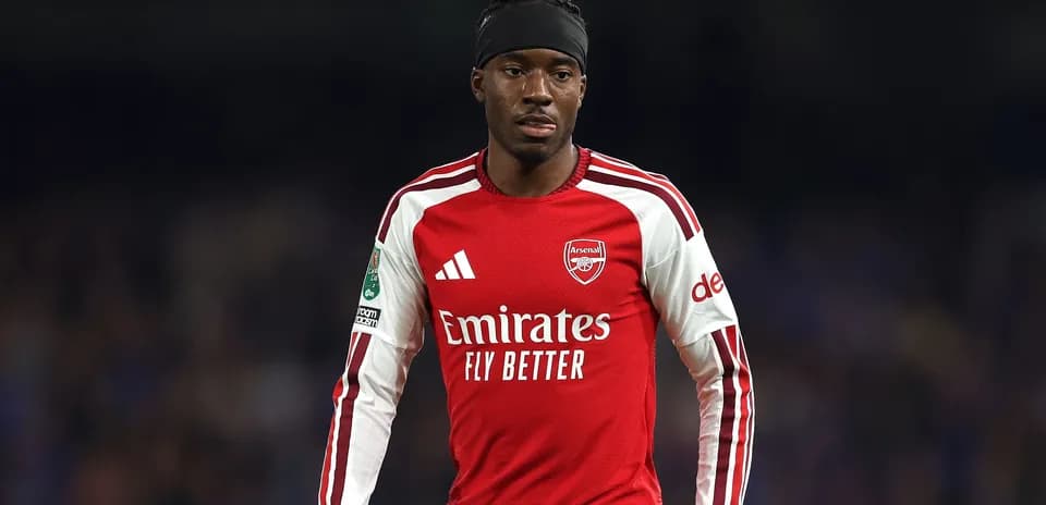 Player wearing Arsenal jersey during match action