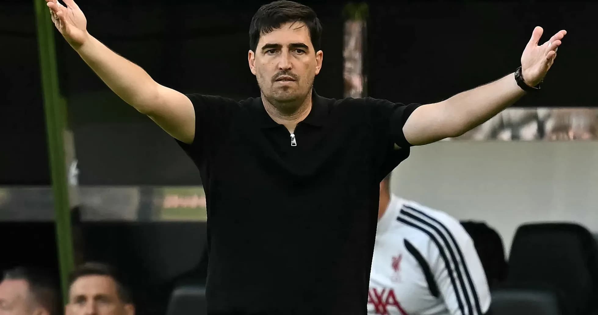 Coach gesturing during match from the sidelines