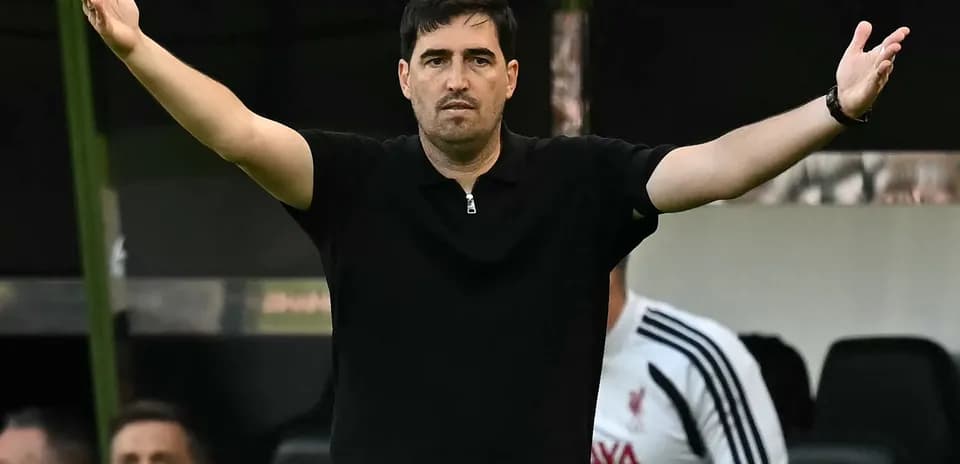 Coach gesturing during match from the sidelines
