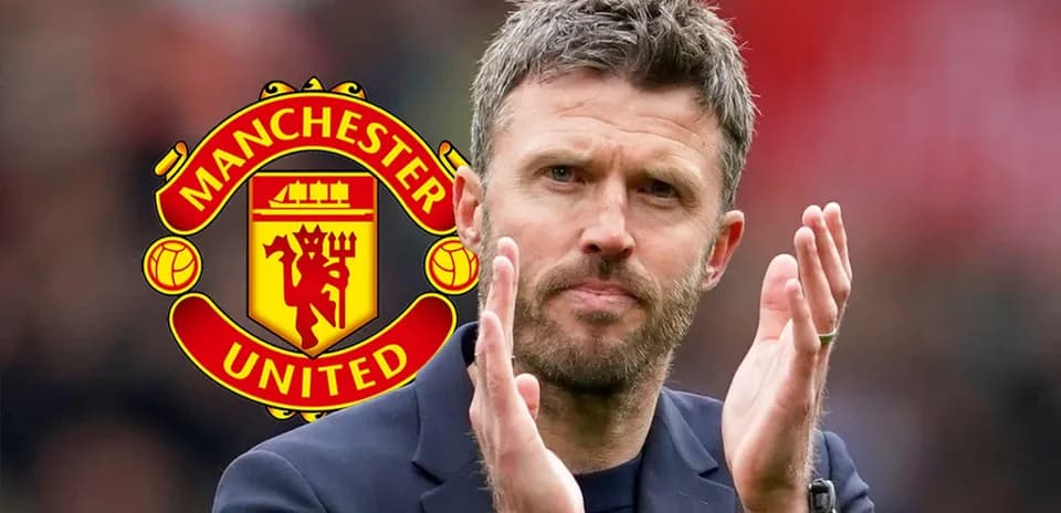 Manager applauding with Manchester United logo in background