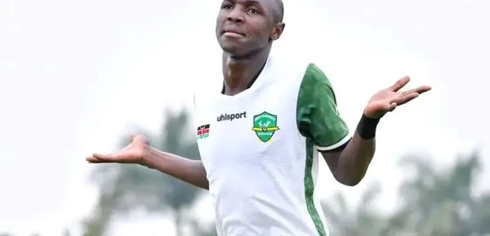 Player celebrating with arms raised during match