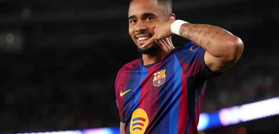 Player celebrating a goal with hand gesture