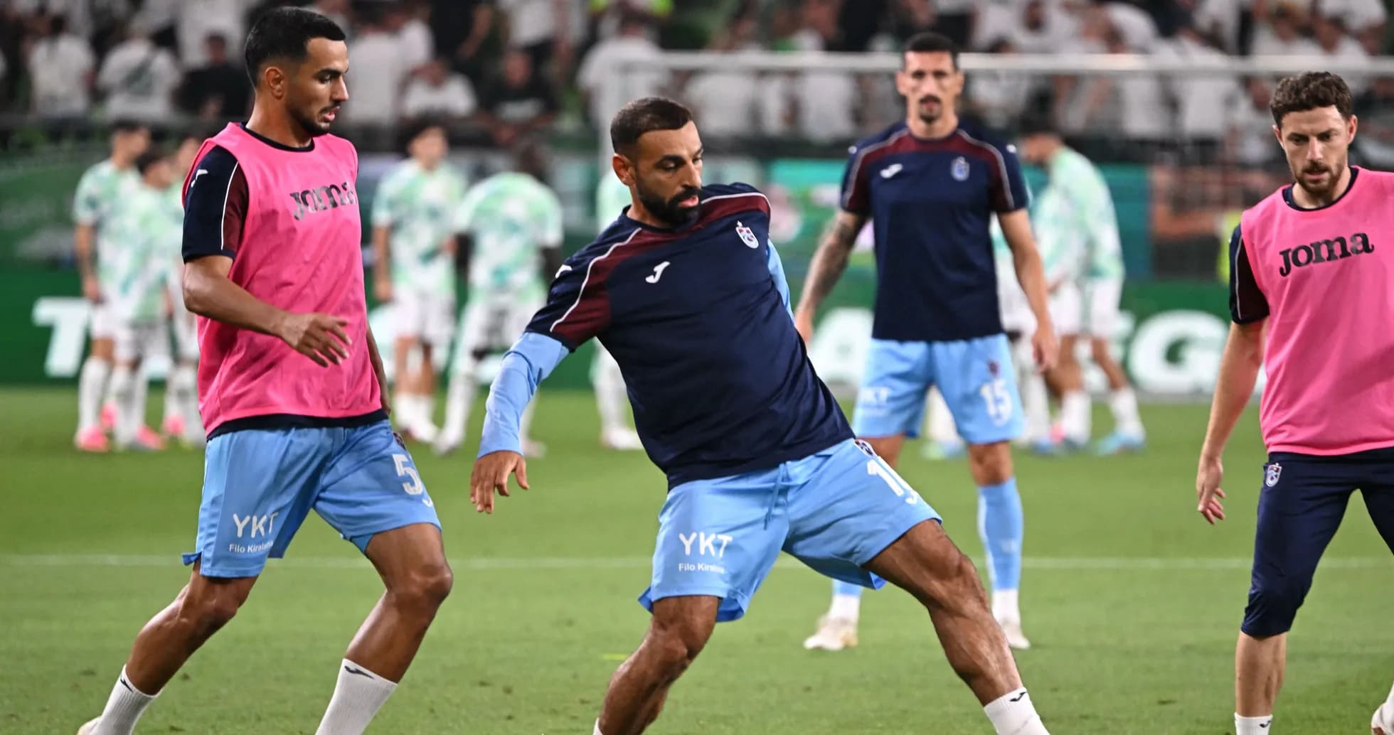 Players warming up on the field before match