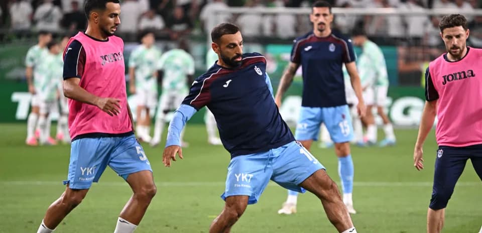 Players warming up on the field before match