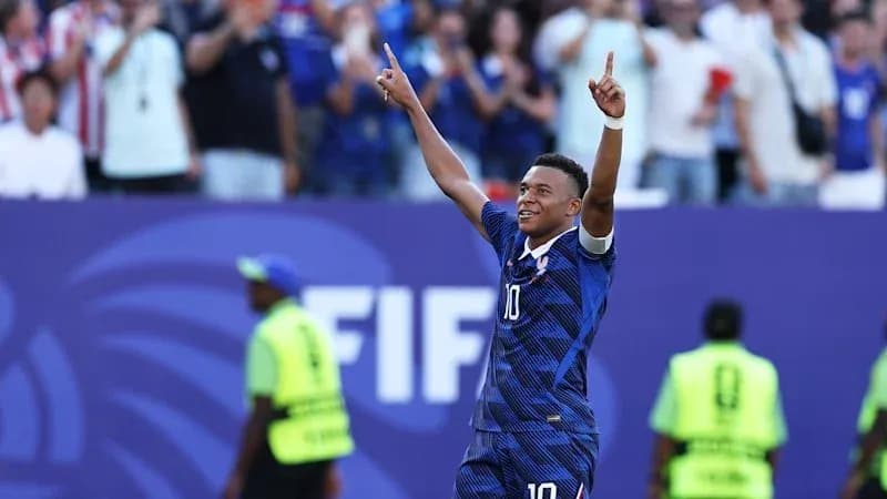 Player celebrating with fans after scoring a goal