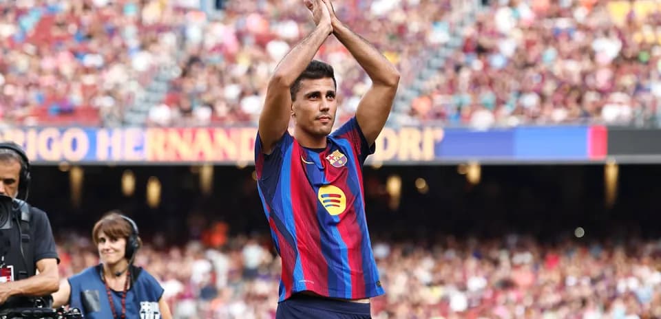 Player applauding fans at Camp Nou stadium