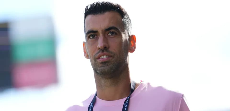 Player wearing a pink shirt at stadium