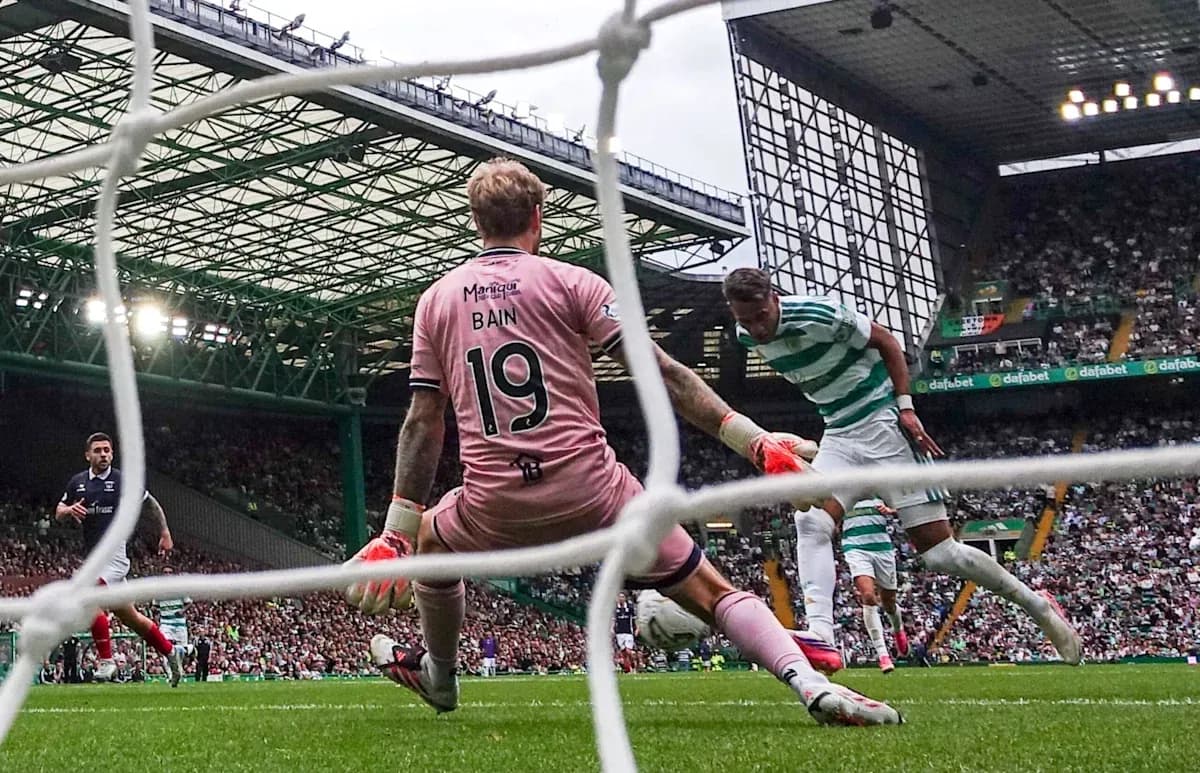 Goalkeeper Bain attempting to block a shot on goal